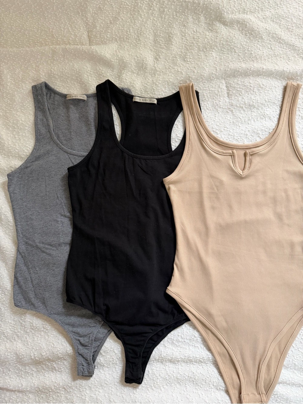 Three-Pack Women’s Ribbed Bodysuits - Black, Gray & Nude